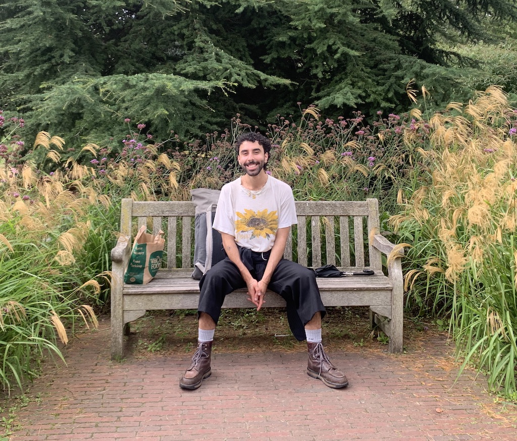 Alex sat on a bench